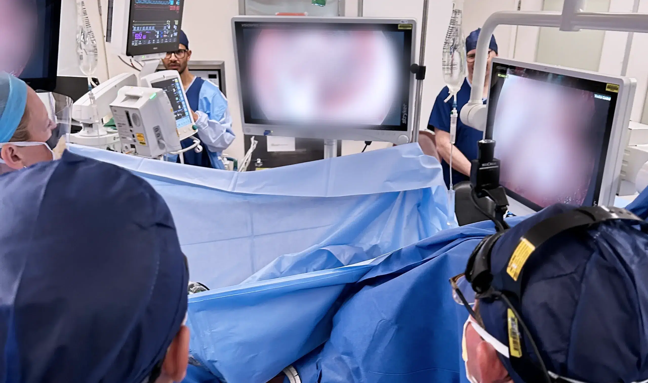 Surgeons operating in a high-tech theatre